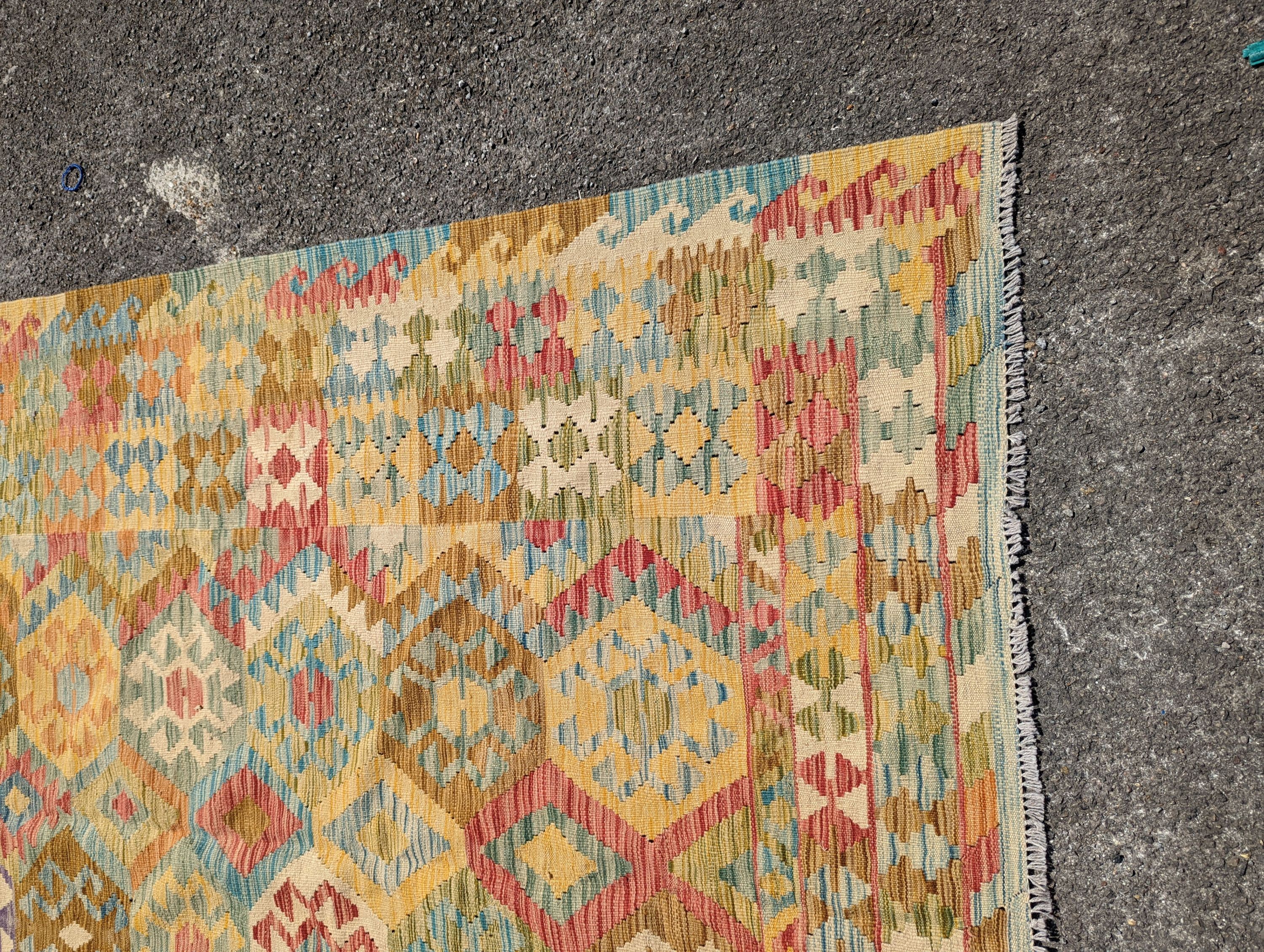 An Anatolian design polychrome geometric flatweave Kilim carpet 270 x 200cm